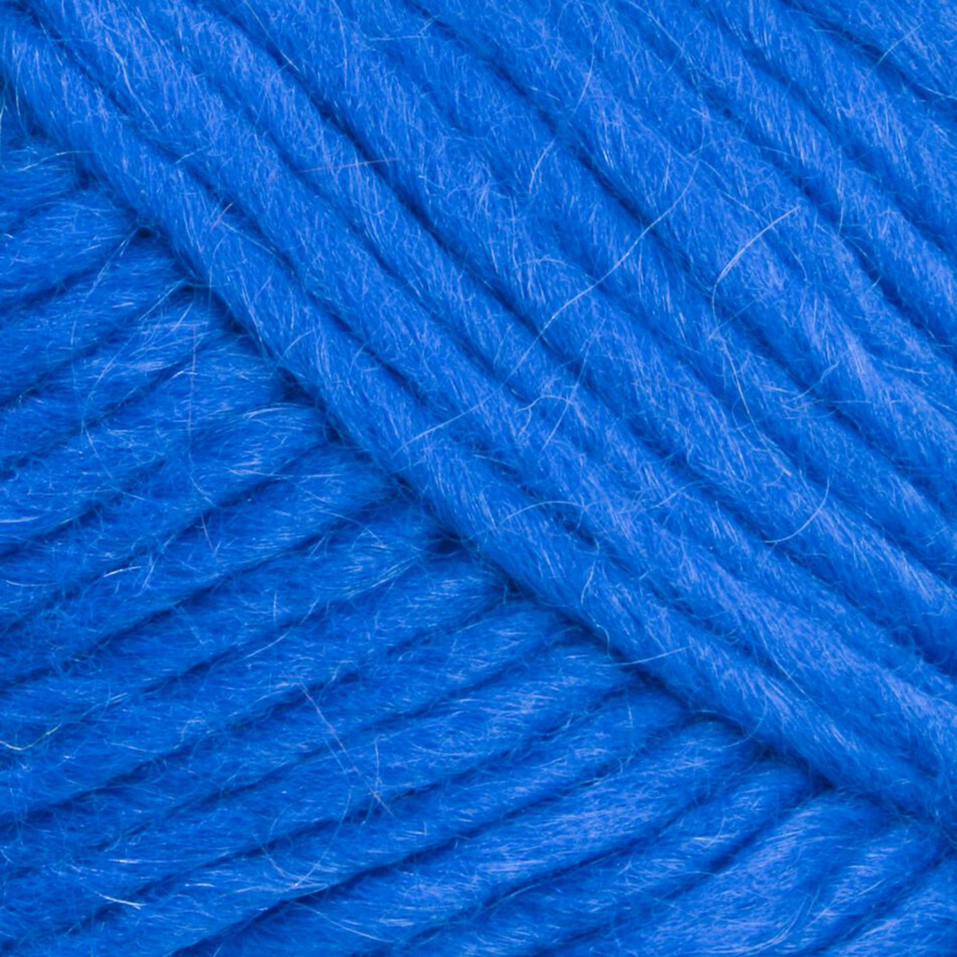 Close-up image of Lamb's Pride Worsted Yarn by Brown Sheep. The yarn is thick, with a slightly fuzzy texture, wound tightly into a ball, showcasing its vibrant blue color and soft fibers—ideal for felting projects or Navajo-style weaving.