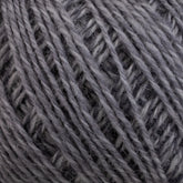 Close-up of a ball of Knitting Fever Painted Desert Yarn by Euro Yarns, showcasing the detailed texture with tightly wound strands. The yarn fibers appear to be soft and slightly fuzzy, indicating a wool or wool-blend material. Long color changes offer a myriad of possibilities for lightweight accessories, emphasizing the intricate crisscross patterns of the threads.