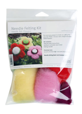 Image of a needle felting kit package labeled "Ashford Needle Felting Kit: Needle Felt Flowers." The package shows five colorful felt flowers and includes instructions, felting needles, and various colors of Ashford corriedale wool slivers by Ashford Handicrafts Limited. Note that needle felting foam is not included.