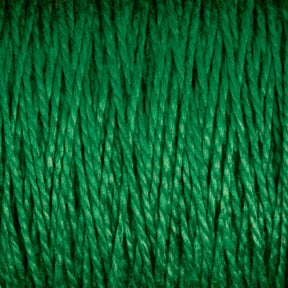 Close-up image of tightly packed, thick Supreme Corp.'s 10/2 Pearl Cotton Yarn | Mini-cone fibers arranged vertically. The texture appears slightly shiny, with a uniform pattern and rich emerald color. This versatile yarn ensures colorfastness and durability.