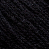 Close-up image of dark, textured Harrisville Designs' Harrisville Highland - Cones yarn. The unscoured yarn appears tightly woven, with subtle variations in color from dark charcoal to almost black. The texture is slightly coarse, with visible strands and fibers interwoven, creating a rich and dense appearance.