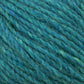 Close-up of thick strands of Harrisville Designs' Peace Fleece Yarn in blue and green intertwined together, creating a textured pattern. The fibers, a blend of wool and mohair, have slight variations in color and thickness, giving the worsted weight knitting yarn a natural and slightly rustic appearance.