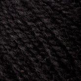 Close-up image of dark black yarn, showcasing its textured fibers and twisted strands. The Bartlettyarns Maine Wool Yarn appears soft and slightly fuzzy, with a dense and uniform pattern, characteristic of worsted weight yarn. Subtle heathered colors add depth to the elegant black hue.