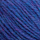 Close-up image of Harrisville Shetland Yarn - Unwashed Cones from Harrisville Designs showcases the intertwined fibers in blue and purple, creating a variegated effect with hints of pink. The texture appears soft and slightly fuzzy, making it ideal for Fair Isle knitting designs that bring out a cozy and warm material.