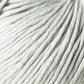 Close-up image of a ball of soft, thick, light grey Jo Sharp Soho Summer DK Cotton yarn from Kingfisher Yarn & Fibre. The yarn strands are neatly wound and appear smooth and slightly shiny, indicating a high-quality material. The texture is prominently displayed, showcasing the tight twisting of the threads.