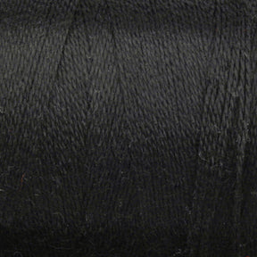 Close-up image of a spool of Maurice Brassard 8/2 Tencel Yarn | Mini Cone in black, featuring a textured surface. The yarn appears tightly wound and smooth, displaying slight variations with fine strands and fibers, making it ideal for weaving projects.