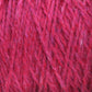 Close-up of Harrisville Designs' Shetland Yarn - Unwashed Cones. The yarn appears fluffy and soft, with a mix of darker and lighter red tones creating a textured and rich visual effect. The intertwining strands suggest a wool-blend material ideal for knitting lightweight blankets or Fair Isle knitting designs.