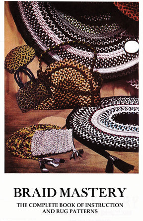 Cover of "Braid Mastery" by BraidAid from Halcyon Yarn, featuring braid rugs in various patterns and colors. The image showcases several braided items, including rugs and a basket, all crafted with intricate designs using advanced braiding techniques.