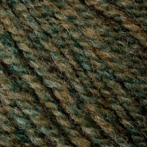 A close-up of Bartlett Maine Wool, Sport Weight Cones by Bartlettyarns reveals textured fabric in green and brown shades. The woven or knitted fibers form a soft, slightly fuzzy surface with a homespun appearance, blending colors for a natural, earthy feel.