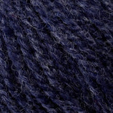 Close-up image of textured Bartlett Maine Wool, Sport Weight Cones by Bartlettyarns in deep navy blue with lighter strands interwoven, showcasing rich, intricate patterns that highlight the softness and warmth typical of sport weight wool with a charming homespun appearance.