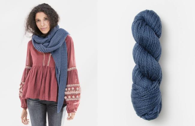 woman wearing blue waverly wrap and skein of matching blue cotton yarn